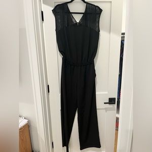 Black jumpsuit with sheer shoulders